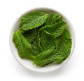 Bowl of mint leaves isolated on white, from above Royalty Free Stock Photo