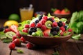 Bowl of Mixed Berries and Kiwis on Wooden Table, Salad with fresh fruits and berries displayed on a wooden table, representing Royalty Free Stock Photo