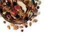 Bowl with mixed dried fruits and nuts on white background, top view Royalty Free Stock Photo