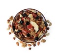 Bowl with mixed dried fruits and nuts on white background, top view Royalty Free Stock Photo