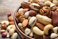 Bowl with mixed organic nuts on table Royalty Free Stock Photo