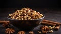 Mixed Nuts and Spices in Dark Bowl with Cinnamon Sticks and Star Anise Royalty Free Stock Photo