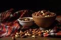 a bowl of mixed roasted nuts on a plain tablecloth Royalty Free Stock Photo