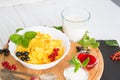 Bowl of muesli and yogurt with fresh berries Healthy tasty breakfast cornflakes with strawberries, raspberries, black Royalty Free Stock Photo