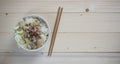 Bowl noodle with vegetable on background