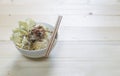 Bowl noodle with vegetable on background