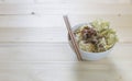 Bowl noodle with vegetable on wood background