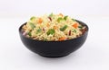 Bowl noodles with vegetables on white background