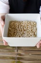 Bowl of noodles on wooden table. Royalty Free Stock Photo