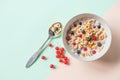 Bowl of oat cereal with blueberry,red currant and spoon.Oat ring cereal with berries and milk.concept of healthy Royalty Free Stock Photo