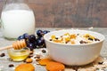 Bowl of oat muesli with fruits, berries, honey and nuts Royalty Free Stock Photo