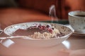 Bowl of oat porridge with frozen wild berries. Royalty Free Stock Photo