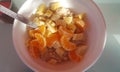 Bowl of oatmeal with banana and tangerine. Useful healthy breakfast