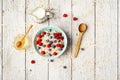 Bowl of oatmeal porridge with blueberry on vintage table with honey and milk. Top view in flat lay style. Healthy Royalty Free Stock Photo