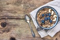 Bowl of oatmeal porridge with blueberries and cashew Royalty Free Stock Photo