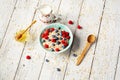 Bowl of oatmeal porridge with blueberry on vintage table with honey and milk. Top view in flat lay style. Healthy Royalty Free Stock Photo