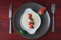 Bowl of oatmeal porridge with fruits and greens, hot and healthy food for Breakfast, top view Royalty Free Stock Photo