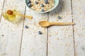 Bowl of oatmeal porridge with milk, honey and blueberry on vintage table top view in flat lay style. Hot breakfast and Royalty Free Stock Photo