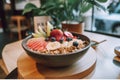 A bowl of oatmeal topped with fruit and nuts. Generative AI image.