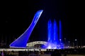 Bowl of the Olympic flame Firebird and singing Fountain in the Olympic park in the evening