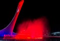 Bowl of the Olympic flame Firebird and singing Fountain in the Olympic park in the evening