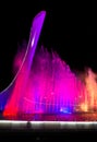 Bowl of the Olympic flame Firebird and singing Fountain in the Olympic park in the evening