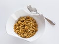 Bowl of organic granola with spoon Royalty Free Stock Photo