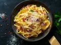 A bowl of pasta with bacon and parmesan cheese Royalty Free Stock Photo