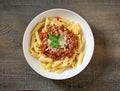 bowl of pasta penne with sauce bolognese