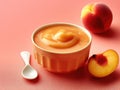 Bowl of peach yogurt with a spoon next to a peach