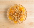 Bowl of peaches with brown sugar and oats on counter top Royalty Free Stock Photo