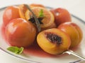 Bowl of Peaches Poached in Sauternes Wine