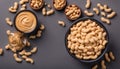 Bowl of peanut butter and peanuts on table background. top view with copy space. Creamy peanut pasta in small bowl