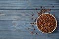 Bowl with pine nuts and space for text on wooden background Royalty Free Stock Photo