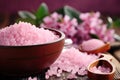 bowl of pink bath salt with flowers on wooden table, closeup, Concept of spa treatment with pink salt, AI Generated Royalty Free Stock Photo