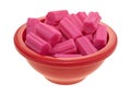 Bowl of pink bubble gum on a white background Royalty Free Stock Photo