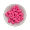 Bowl of pink bubble gum on a white background Royalty Free Stock Photo