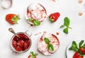 Bowl of pink strawberry ice cream and fresh berries on white background. Top view Royalty Free Stock Photo