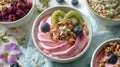 Bowl of pink yogurt topped with fruit and granola. Royalty Free Stock Photo