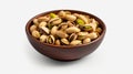 Photo of a bowl of delicious pistachio nuts on a clean white background