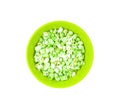 A bowl of popcorn isolated on white background. Tasty popcorn on green bowl Royalty Free Stock Photo
