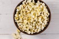 Bowl with popcorn on wooden table Royalty Free Stock Photo