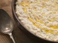 Bowl of Porridge with Golden Syrup Royalty Free Stock Photo