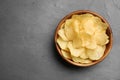 Bowl of potato chips on grey table, top view Royalty Free Stock Photo