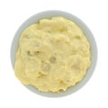 Bowl of potato and eggs salad on a white background