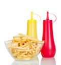 Bowl of potato fries, ketchup and mustard isolated on white. Royalty Free Stock Photo