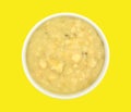 Bowl of potato leek soup on yellow background Royalty Free Stock Photo