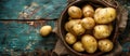Bowl of Potatoes on Wooden Table Royalty Free Stock Photo