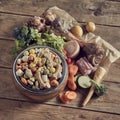 Bowl of premium dried dog biscuits with vegetable ingredients