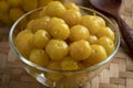 Bowl with preserved star gooseberry, Mayom close up